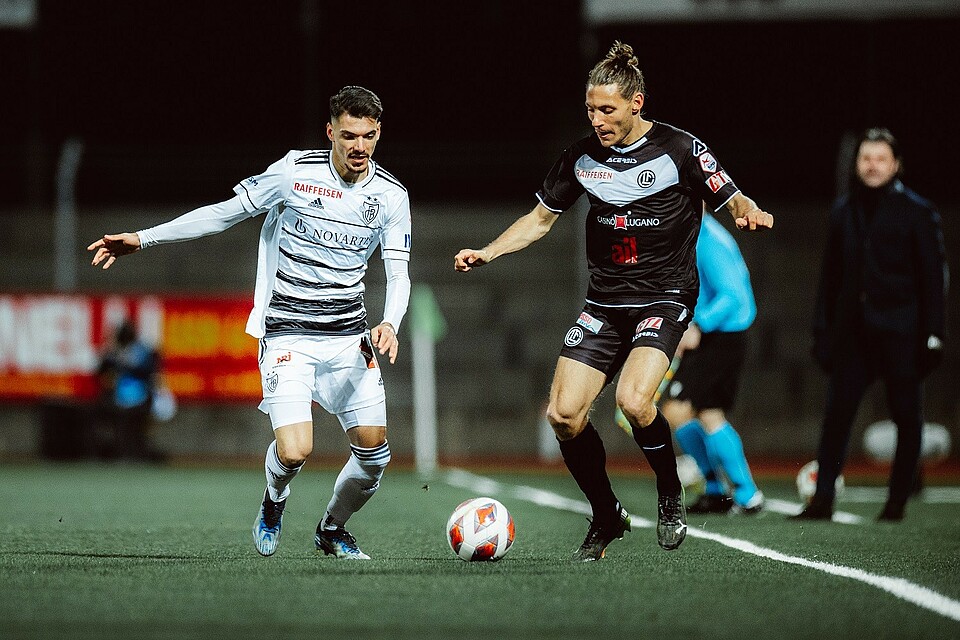 Lugano, Switzerland. 29th Nov, 2020. Cristopher Lungoyi (#8 FC Lugano) and  Albian Hajdari (#76 FC Basel 1893) in action during the Swiss Super League  match between FC Lugano and FC Basel 1893